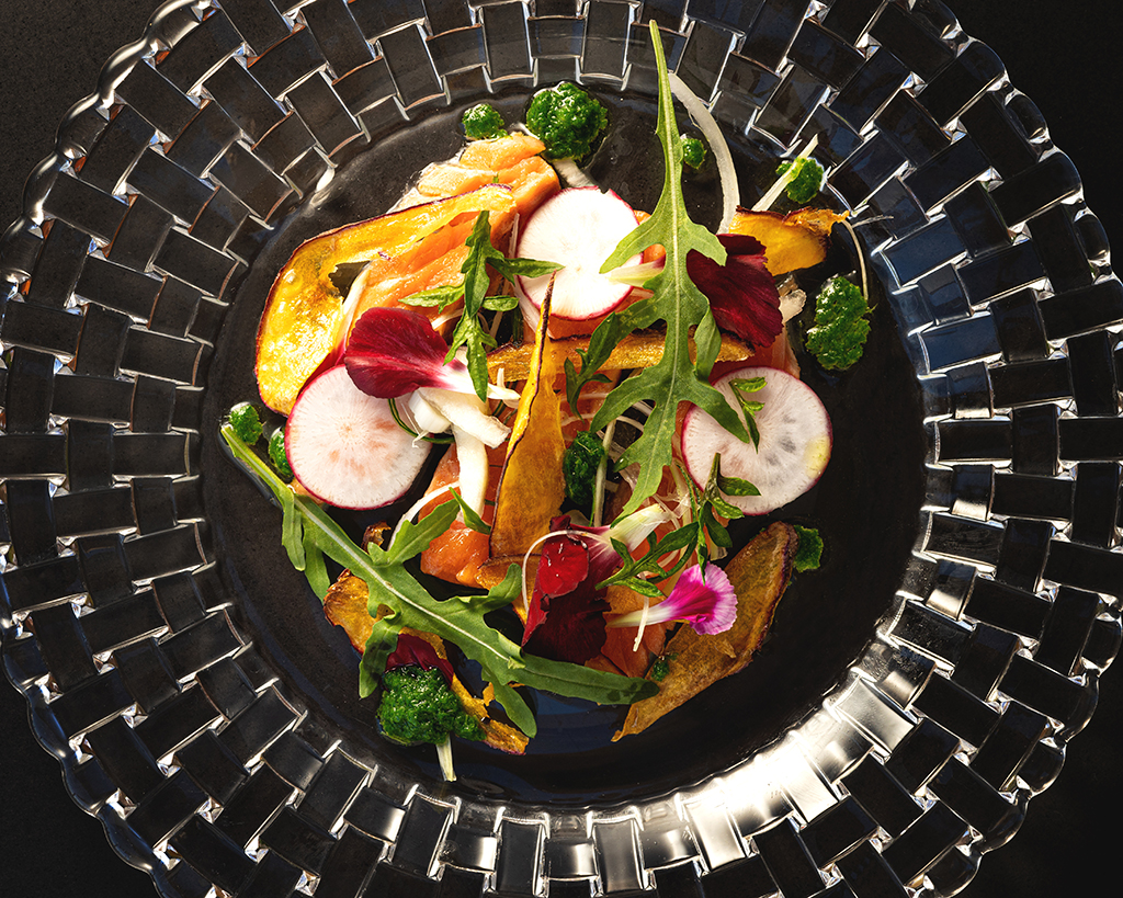 salmon with vegetables, flowers and sweet potato chips